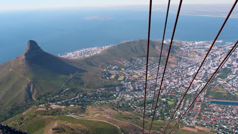 pov from cable car on table mountain of lion's head and signal hill, cape town