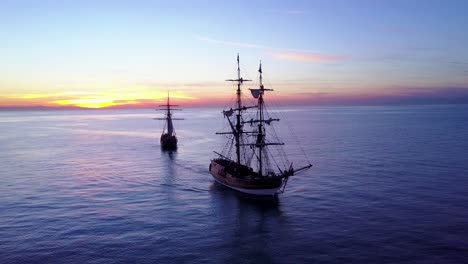 spectacular aerial of two tall sailing ships on the open ocean 4