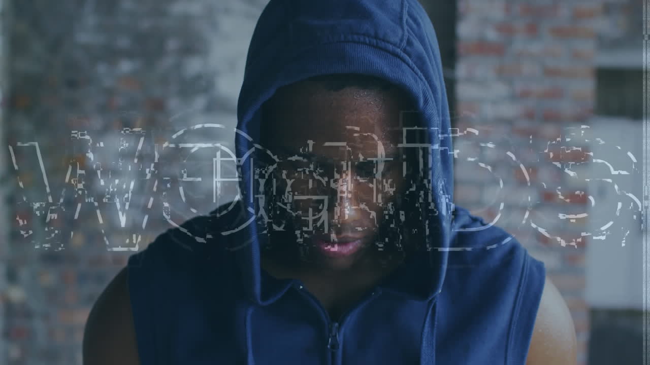 Animation of fight text over african american sportsman at gym