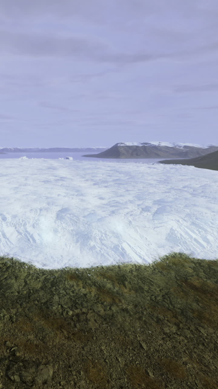 Majestic glacier stretches across the horizon under a soft cloudy sky