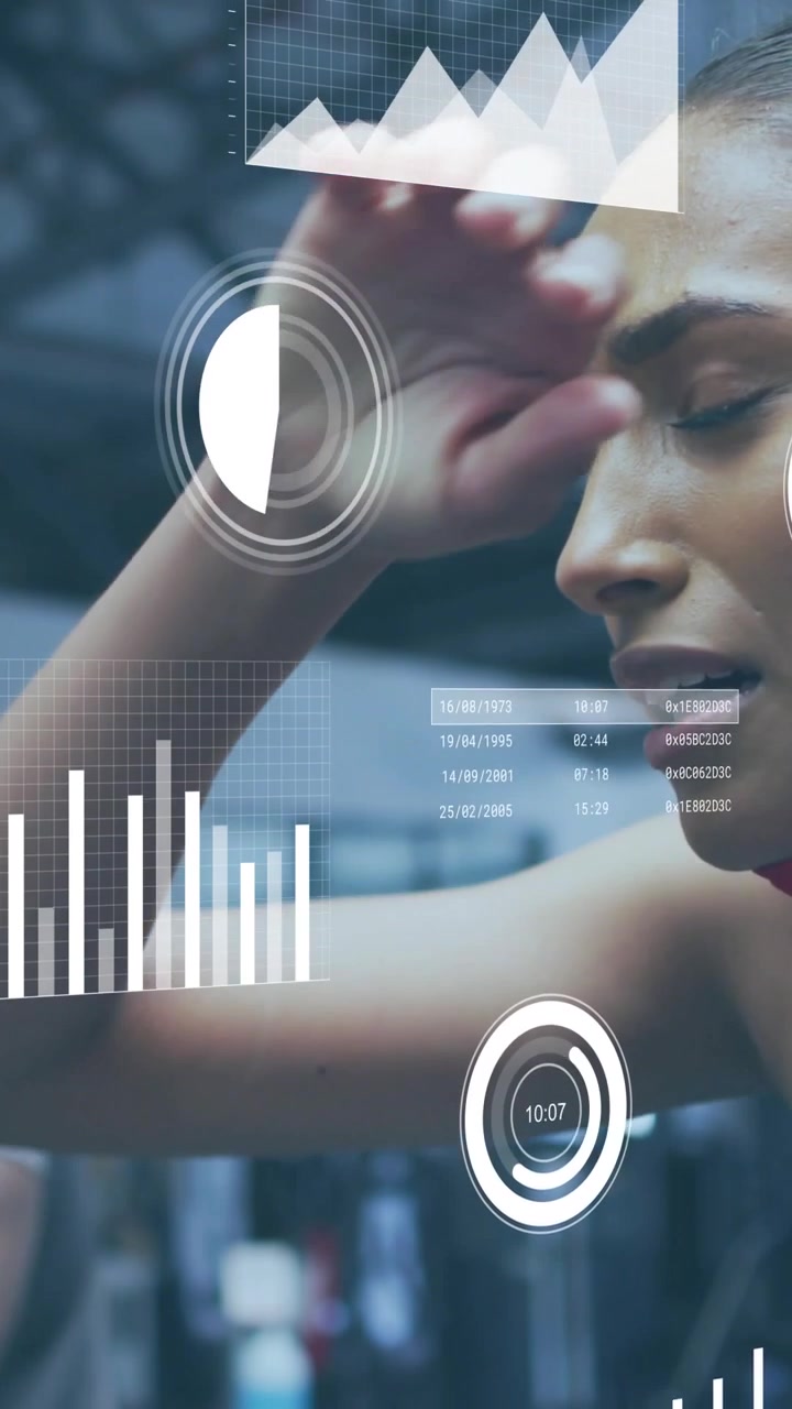 Vertical video: Woman riding on bike starting workout, viewing live graphs and dials tracking power