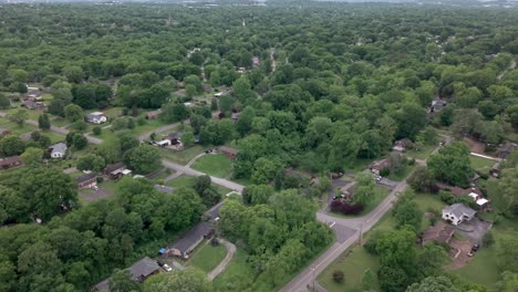 a beautiful aerial view of a suburban nashville area surrounded by lush green vegetation. push forward