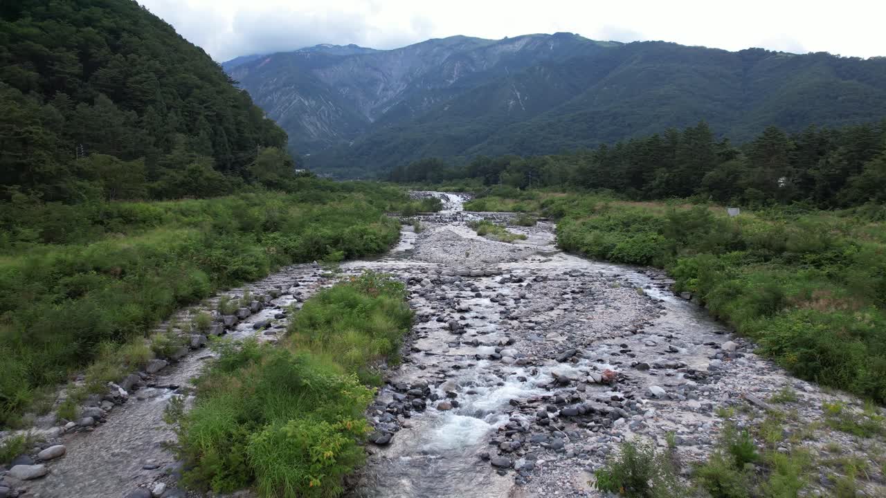 Matsu River Flowing Through Hakuba Valley In Japan - Drone Shot