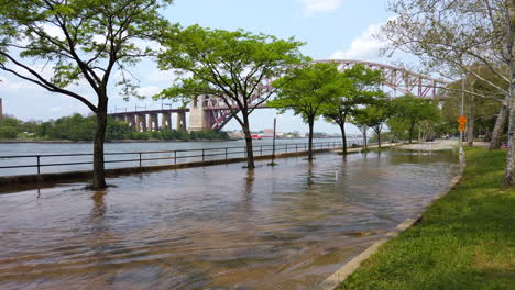 flooded road in astoria park, queens, nyc.