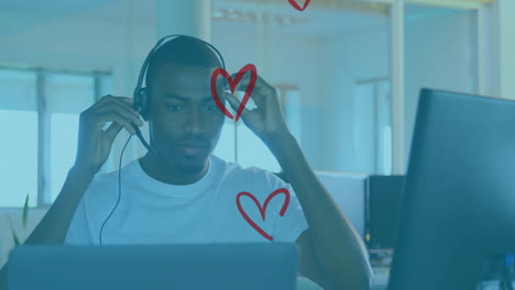business customer service agent adjusting headset at office desk, with floating red heart doodles