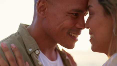 Love,-beach-hug-and-couple-face-closeup-by-the-sea