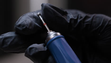 close-up of hand held tools with gloves