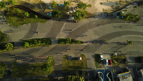 people walking and cycling on boardwalk of kuta mandalika, lombok