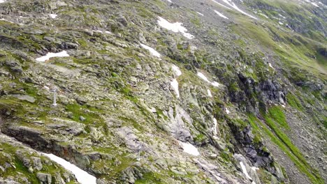 Steep-cliff-partly-covered-in-snow-in-the-Alps-in-Kaernten,-Austria