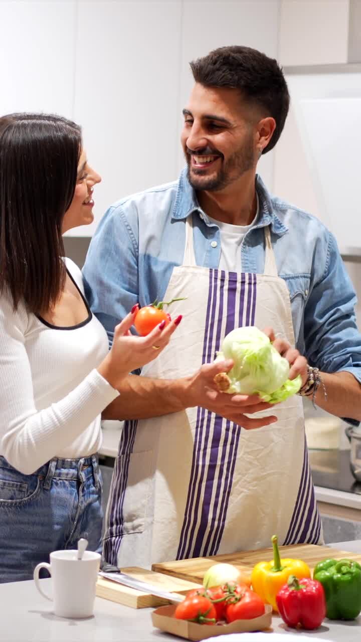 Couple Preparing Vegetables in Kitchen