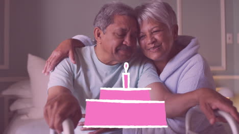 icono de pastel de cumpleaños rosa contra una pareja de ancianos afroamericanos abrazándose en casa