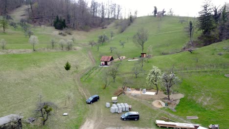 an old rural cabin in the middle of a pasture