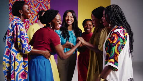 a diverse group of women laughing and celebrating together