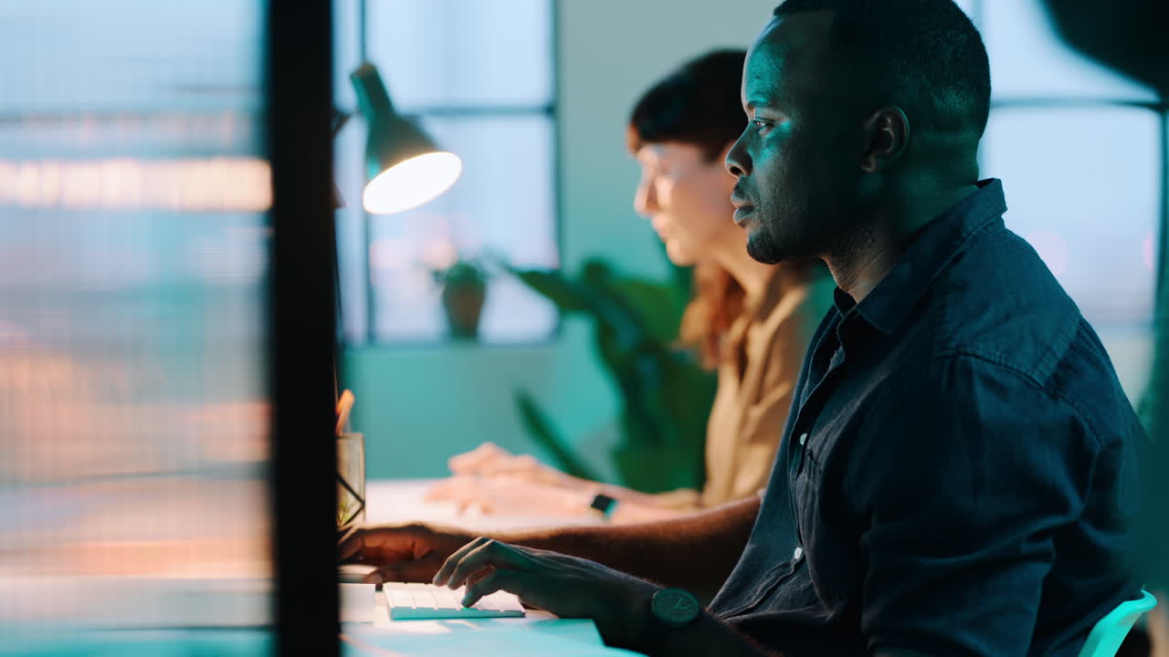 Black man, woman or computer in night office