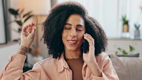 woman with curly hair on a phone call
