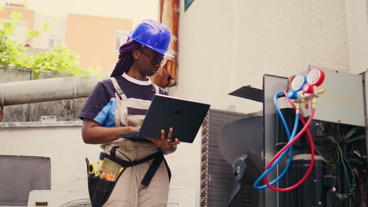 Technician working on HVAC system