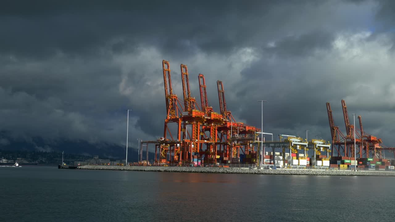 Container Gantry Crane On The Seaport Against Dark Stormy Clouds. Wide Shot
