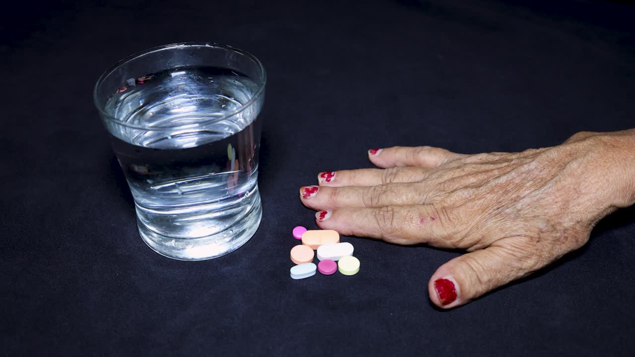 healthcare for seniors with medication and water glass