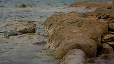 lake water splashing on rocks. slow motion shot