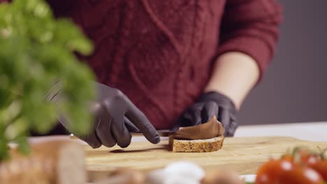 hands spreading velvety chocolate hazelnut spread on crunchy whole grain bread. a perfect breakfast moment captured in detail, highlighting rich textures, creamy consistency, and indulgence