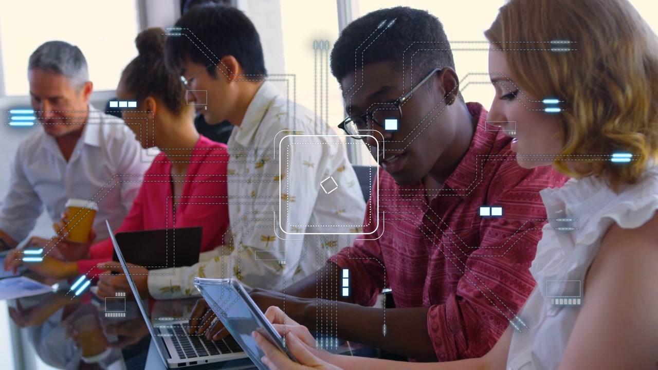 Man in red shirt switching between tablet and laptop while HUD animating into overlay for business