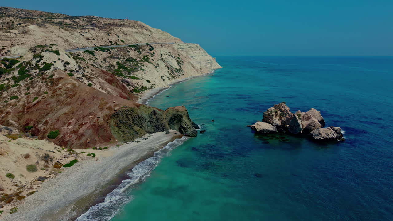 Aerial view with Aphrodite's rock in the blue waters of the Mediterranean Sea in Cyprus