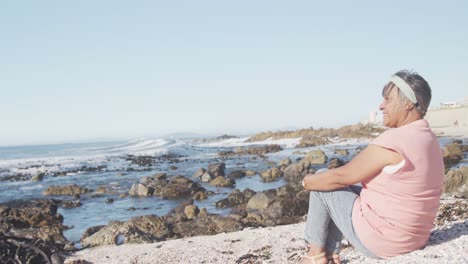 senior african american woman at beach, copy space, slow motion