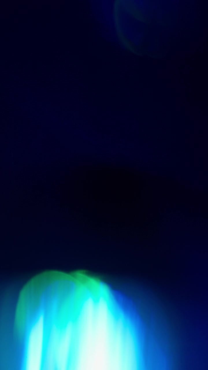 Prism overlays and light leaks. Slow motion. Vertical Format