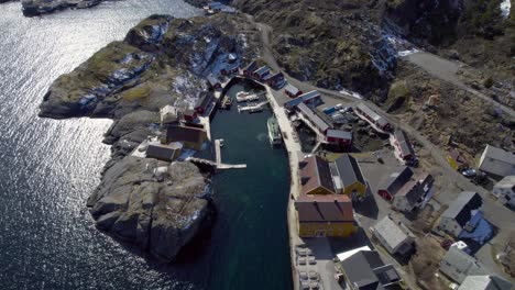 Aerial-revealing-shot-of-the-famous-fishing-village-Nusfjord-on-the-Lofoten-Islands-in-late-winter