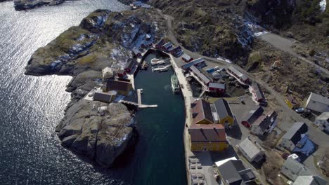 aerial revealing shot of the famous fishing village nusfjord on the lofoten islands in late winter