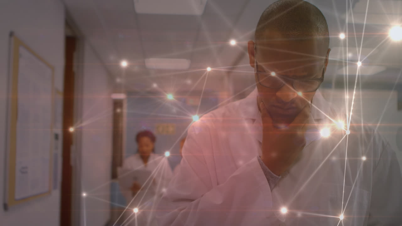 Animation of network of connections over biracial male doctor