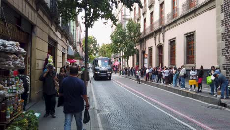 panoramic shot of the historic center of mexico city, observing people, shops, streets, public transportation, and the daily activities taking place in the area