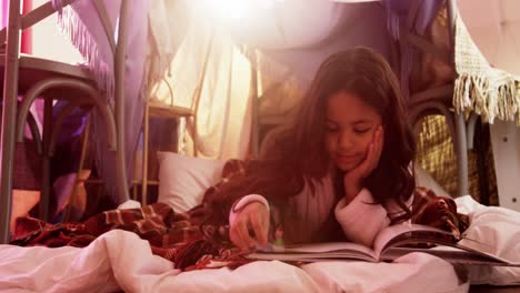 Girl-relaxing-on-mattress-and-reading-book