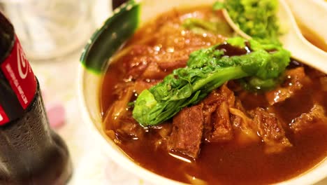 delicious stewed meat noodles with greens and drink