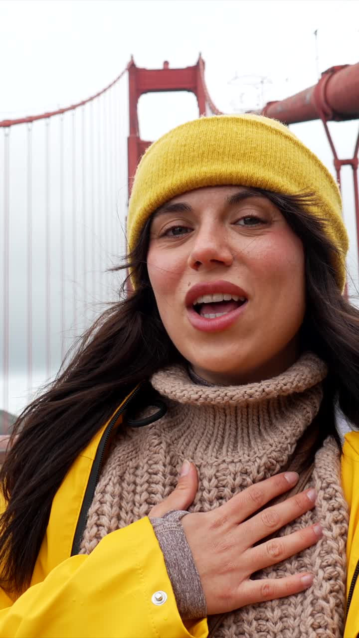 Happy Woman Talking and Smiling on Golden Gate Bridge