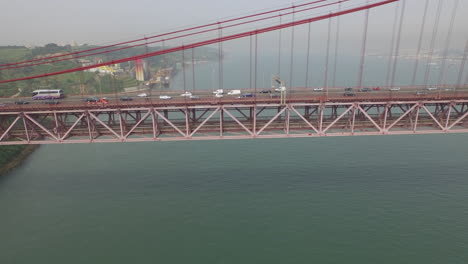 lateral shot at lisbon 25 de abril bridge in portugal