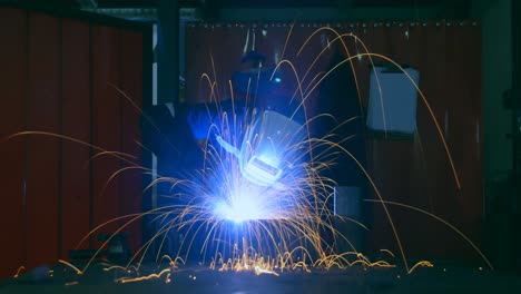time lapse of workers using welding torch in workshop 4k