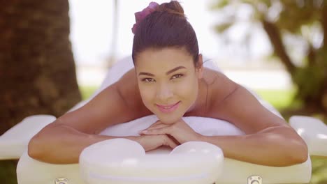 young woman on vacation having a spa treatment