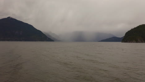 Flying-over-the-water-on-a-cloudy-day-in-the-Pacific-Northwest