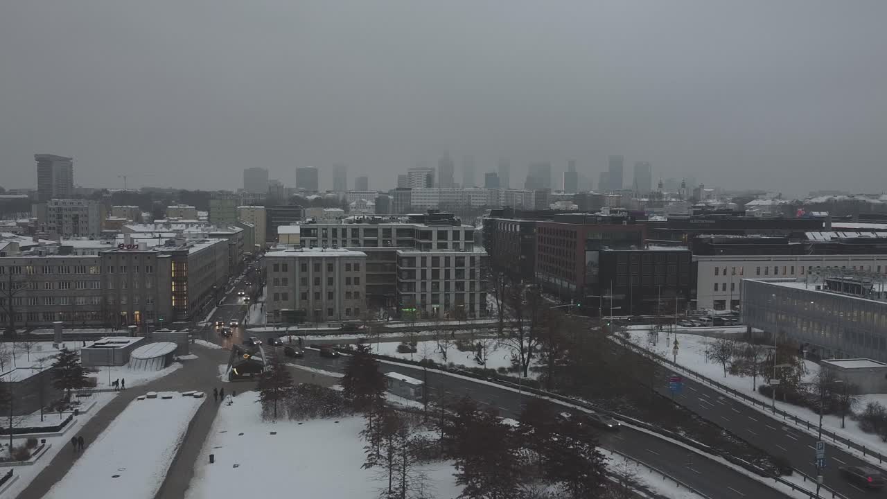 Drone video of warsaw city skyline on a snowy and foggy day4