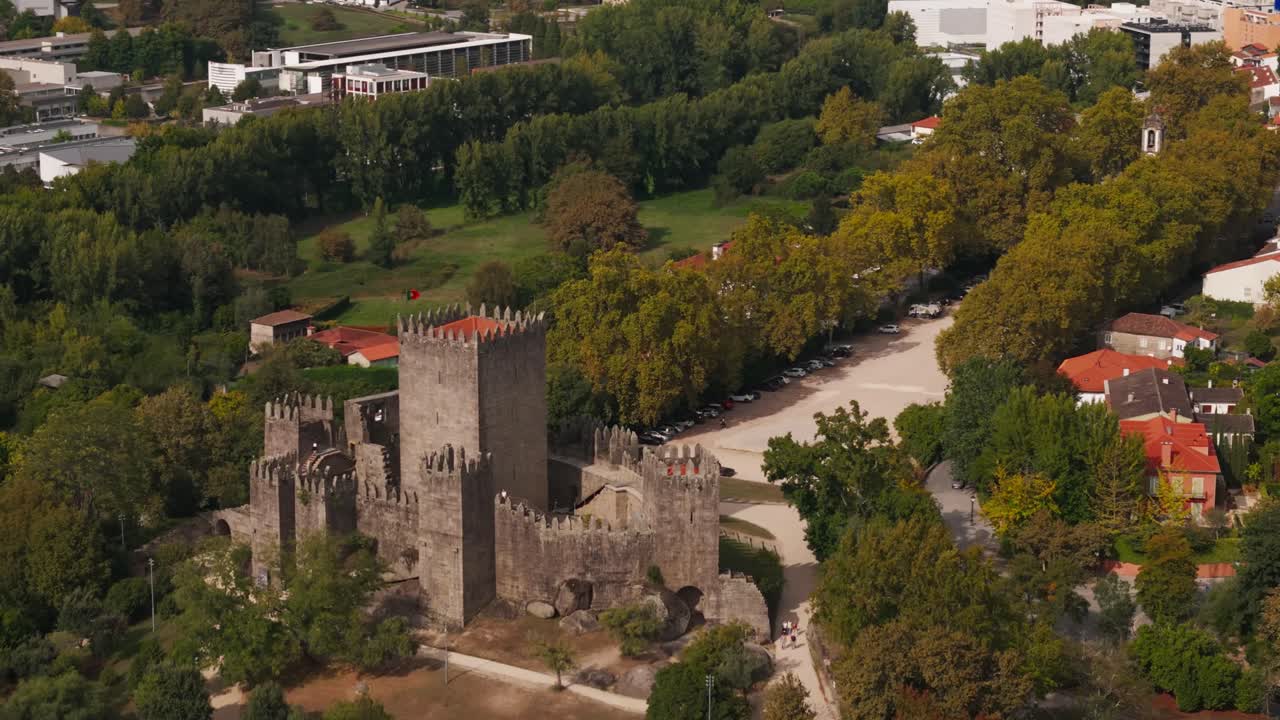 Breathtaking aerial of medieval Guimarães Castle overlooking quaint town