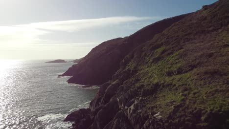 British-Coastline-with-Sun-Flare-and-Calm-Ocean-Sea