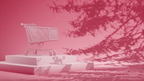 un carrito de compras vacío en una plataforma roja con la sombra de las ramas en un fondo rosa