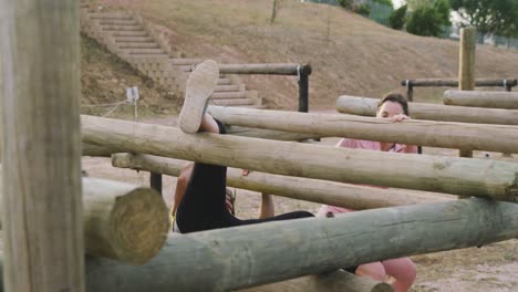 female friends enjoying exercising at boot camp together