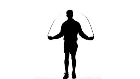 Silhouette-of-a-man-working-out-with-a-rope-on-white-background