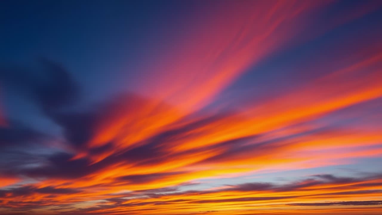 Vibrant Sunset Sky with Streaky Clouds