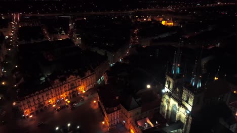 Aerial-Drone-Prague-City-historic-European-center-at-night-Cathedral-streets-on-old-town-square-Staroměstské-náměst?