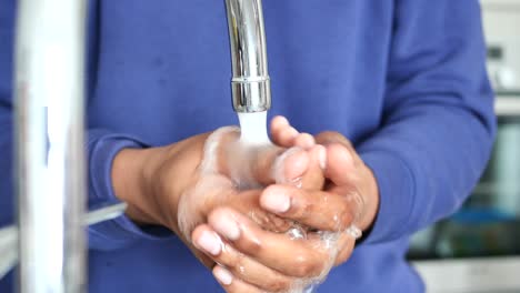 washing hands under running water