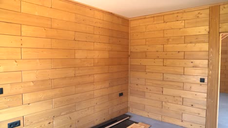 wooden interior corner wall with horizontal timber planks in minimalist room