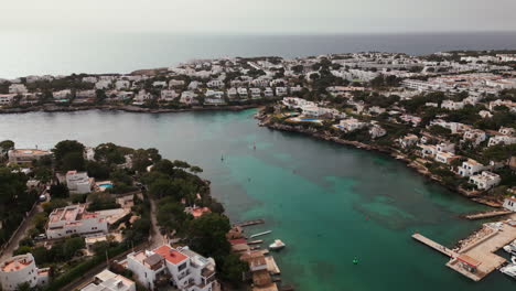 Aerial-view-of-Cala-D'Or-Bay-in-Mallorca,-with-yachts-and-clear-waters